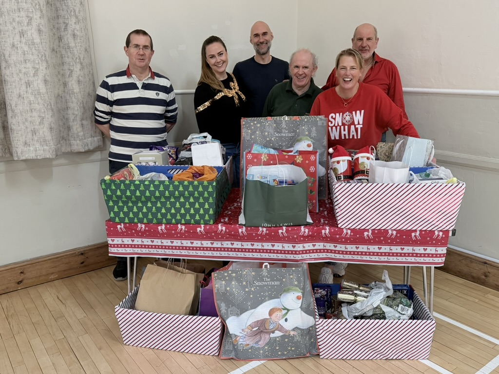 Dumbleton Village Hall committee members and helpers with a Christmas charity collection